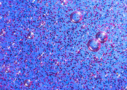 Blue slime with glittering multicolor particles