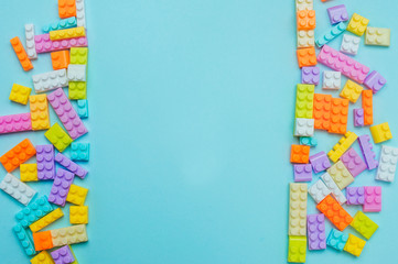 Kids toy blocks on blue background with copy space