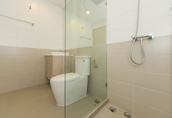 Toilet bowl in modern bathroom interior