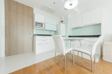 Kitchen interior with timber benchtop, decor and tiled splashback. Modern kitchen interior.