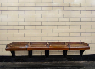 Bench and tiles wall in a subway