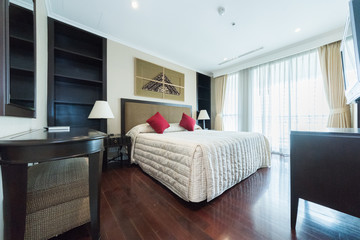 King-size bed in bright bedroom