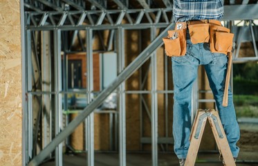 Men Working From a Ladder