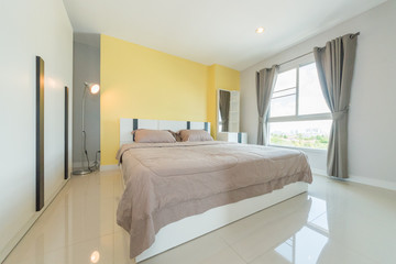 luxury interior of bedroom with large bed 