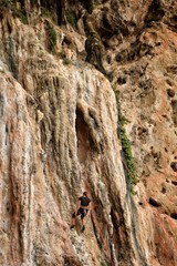 Climber hanging on mountain
