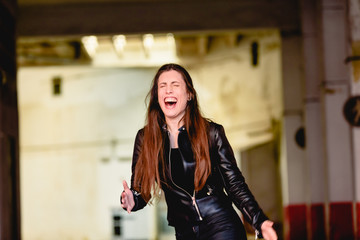 Young woman laughing loudly.