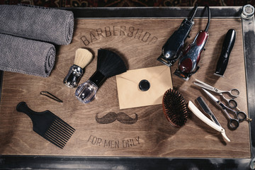 Vintage barber shop hairdresser tools equipment on old wooden background