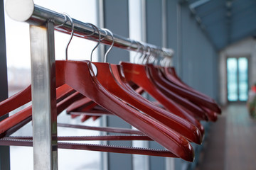 Empty hangers in store, sale is over, wardrobe in a restaurant or cafe