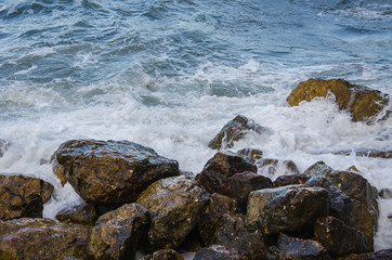 Seascape, sea storm on a wild rocky seashore