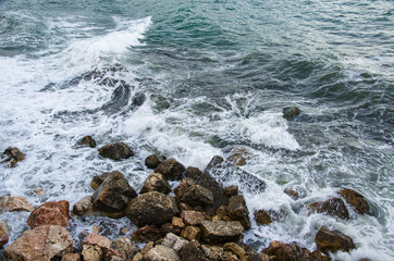 Seascape of dramatic storm, sea waves on wild rocky seashore