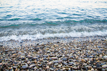 Fototapeta na wymiar Seascape, view of stone beach and sea waves