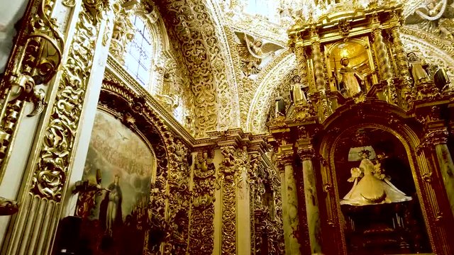 Golden interior of the Rosary Chapel in Puebla, Mexico.