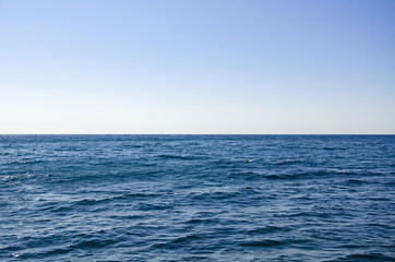 Seascape, view of sea horizon and blue sky
