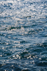 Abstract sea background, colorful ripples of water surface