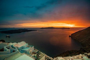Fototapeta na wymiar Unique Sunset Colors at Santorini Island, Greece, one of the most beautiful travel destinations of the world.