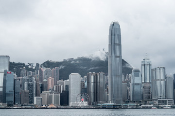 Obraz premium Hong Kong / China - Feb 19 2019: Victoria harbour skyline panorama. Background skyscraper building of big city
