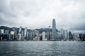 Fototapeta na wymiar Hong Kong / China - Feb 19 2019: Victoria harbour skyline panorama. Background skyscraper building of big city