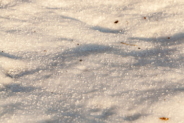 Snow drifts dirt.