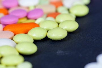 multi-colored tablets and pills