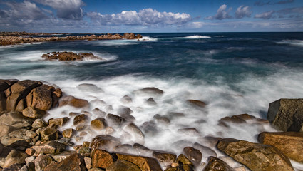 waves crashing on rocks