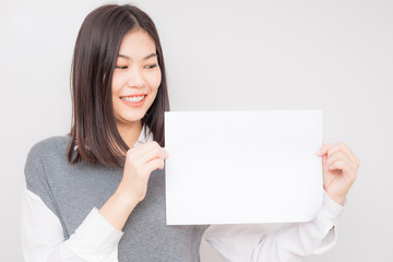 Naklejka premium Smiling business asian women hold blank white paper ads text sapce