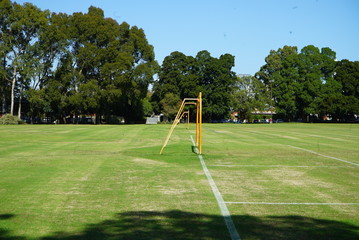 an empty green park with a soccer field © michael
