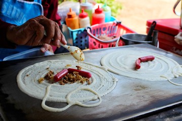  The chef is making desserts on the Japanese crepes oven