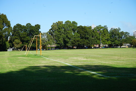an empty park with a soccer field