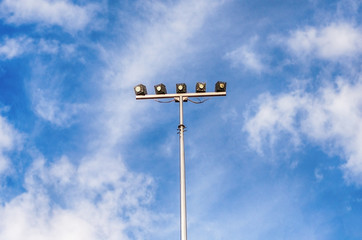 Stadium lighting. Sky, summer. Technology