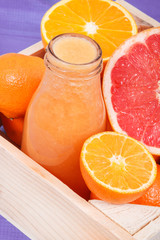 Fresh healthy smoothie from citrus fruits. Dessert containing vitamins. Dieting and slimming concept