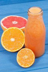 Fresh healthy smoothie from citrus fruits. Dessert containing vitamins. Dieting and slimming concept