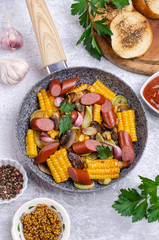 Slices of fried vegetables with sausages
