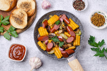 Slices of fried vegetables with sausages