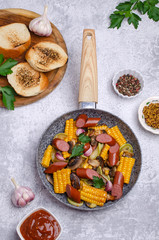 Slices of fried vegetables with sausages