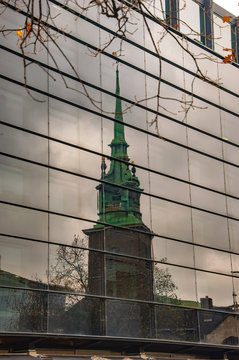 London old church of all hallows by the tower and its reflection