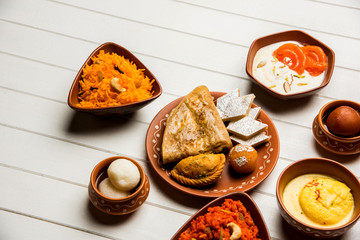 group of Indian Sweet / mithai in terracotta bowl