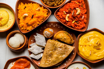 group of Indian Sweet / mithai in terracotta bowl
