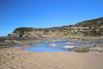 Fototapeta na wymiar Sand Pool on Frazer Beach Australia
