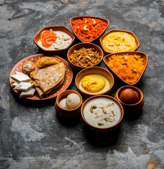 group of Indian Sweet / mithai in terracotta bowl