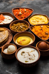 group of Indian Sweet / mithai in terracotta bowl