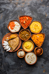 group of Indian Sweet / mithai in terracotta bowl