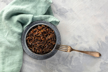 Wild black rice, shot from the top with a fork and a place for text