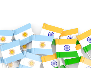 Pins with flags of Argentina and india isolated on white.