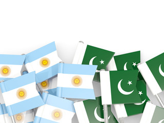 Pins with flags of Argentina and pakistan isolated on white.