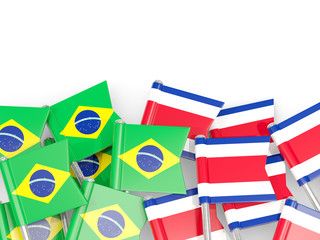 Pins with flags of Brazil and costa rica isolated on white.