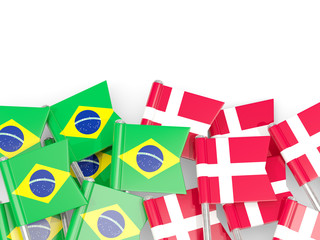 Pins with flags of Brazil and denmark isolated on white.