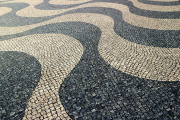 Portuguese pavement of black basalt and white limestone in Lisbon.