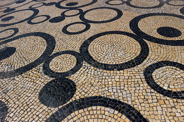 Portuguese pavement of black basalt and white limestone in Lisbon.