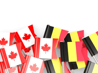 Fototapeta na wymiar Pins with flags of Canada and belgium isolated on white.