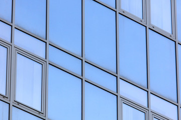 The walls of the house of plastic panels and glass as a background